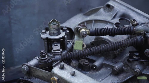 old gear shift box from a front-wheel drive car installing cables and shifting gears disassembly for repair