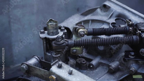 old gear shift box from a front-wheel drive car installing cables and shifting gears disassembly for repair