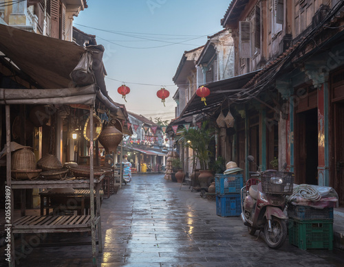 After the rain, an empty lantern street waits like a forgotten line of dialogue