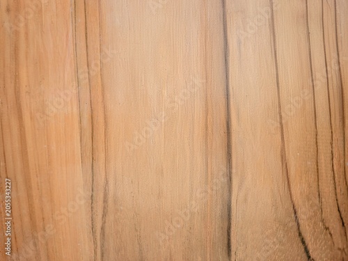 Принти на полотні A close-up shot of a smooth, light brown wooden surface featuring prominent vertical dark grain patterns