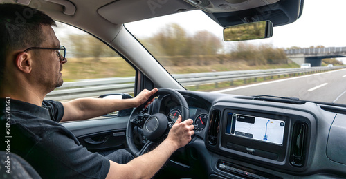Man Driving Car On Highway With Dashboard Navigation