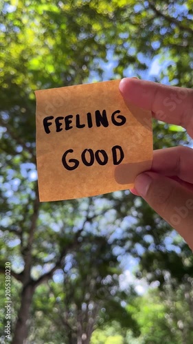Hand holding sticky note with 