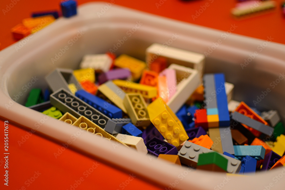 Naklejka premium Lego construction set. Background made of colorful Lego bricks.