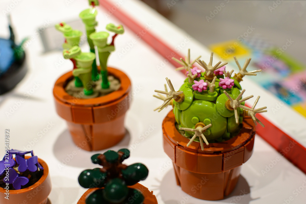 Naklejka premium A cactus made of Lego bricks on a table. Lego constructor