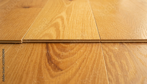 A wooden seam like a quiet fault line, where warm grain becomes a dream map