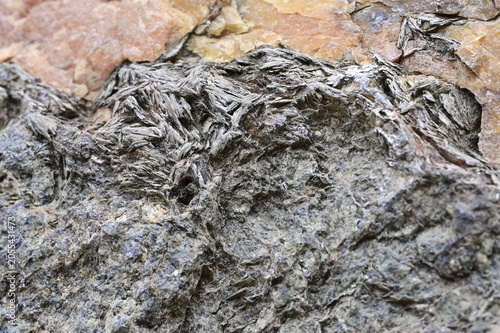 Fotografie Macro View of a Geological Specimen with Mica Embedded in Quartz with Oxides and