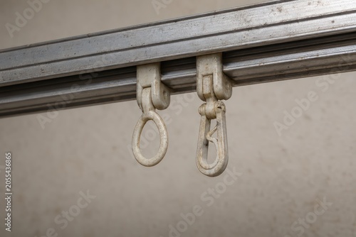 Detail of an old metal door with handle lock and white wall background