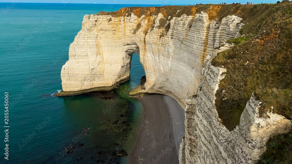 Naklejka premium Picturesque coastal limestone cliffs and the English Channel town of Etretat, Normandy, France