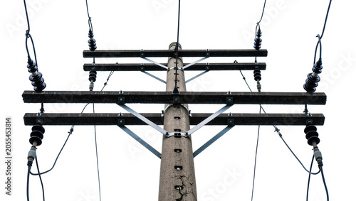 Photos Isolated electrical power pole with dark cables, support beams, and disc insulat