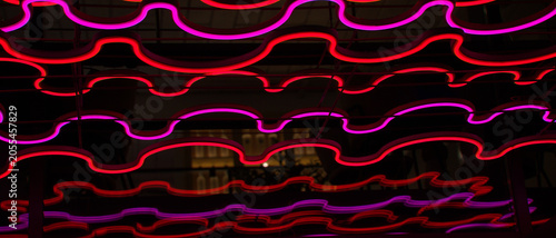 Decorative LED lighting in crimson-red colors with a wave pattern