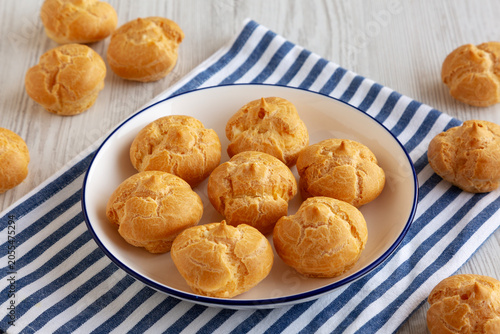 Obraz na plátne Homemade Mini Cream Puff with Whipped Filling, side view.