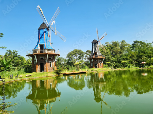 Beautiful views of the reservoir and windmills at The Lost World Farm tourist attraction and camping ground located in Kaliurang,Indonesia.