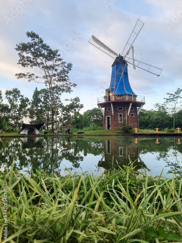 Beautiful views of the reservoir and windmills at The Lost World Farm tourist attraction and camping ground located in Kaliurang,Indonesia.