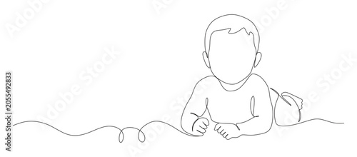 Фотография This image shows a minimalist continuous one-line drawing of a baby lying on their stomach, conveying a sense of innocence and gentle movement