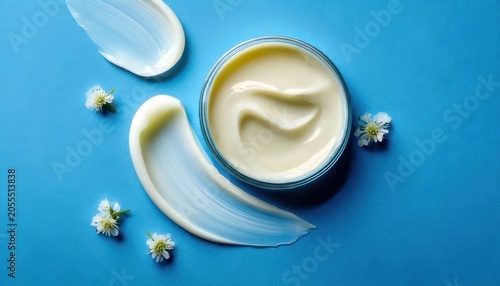 Luxurious Cream and Delicate Flowers on a Serene Blue Surface.