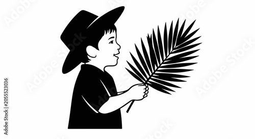 boy holding palm leaf