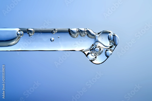 Fotografie Pipette dripping serum for skin barrier repair