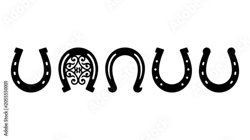 Collection of four horseshoes with various designs on white background