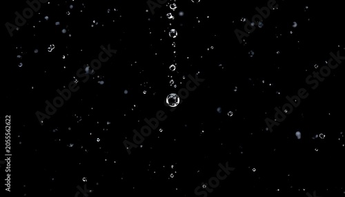 Clean minimalist 3D render of crystal clear water droplets of various sizes on a black background.