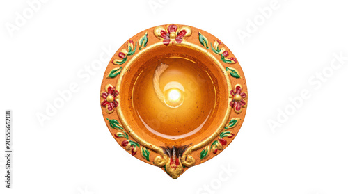 Lit diya oil lamp with decorations isolated on transparent background