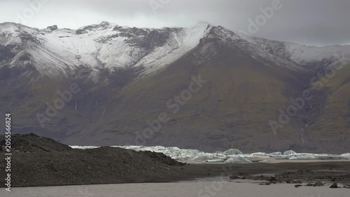 Moody Jokulsarlon glacier with clouds and water, Iceland landscape view