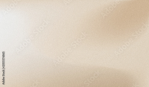 Milky brown beige and cream abstract grainy texture gradient background features a soft side light highlight, subtle fluid folds for a neutral minimalist commercial backdrop.