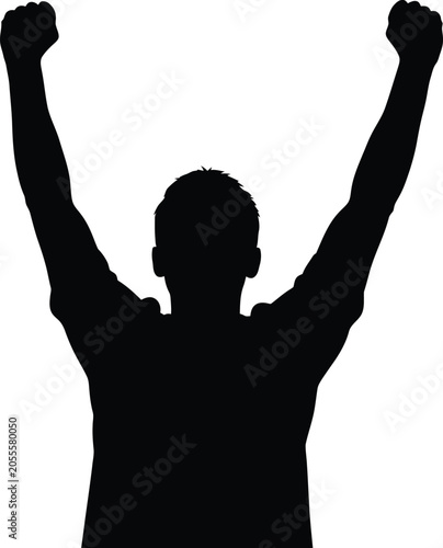 Silhouette of a man with arms raised in victory
