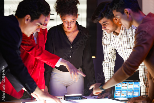 Photos Lead designer presenting mobile application interface prototypes and front-end development layouts to the product development team