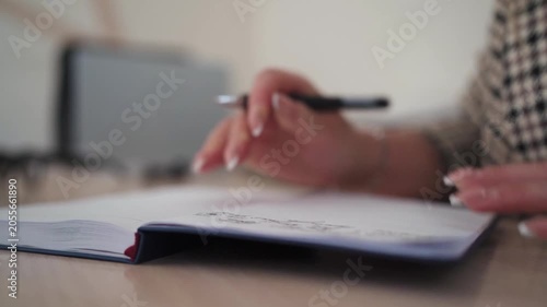 Woman Journaling Personal Thoughts in Notebook