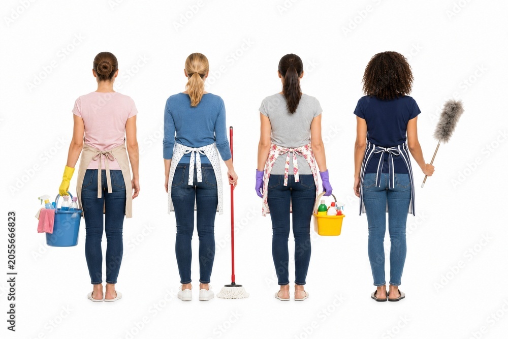 Fototapeta premium Rear view of four professional female cleaners holding cleaning equipment and supplies, isolated on a white background.