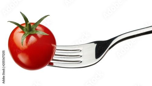 Foto Shiny red cherry tomato impaled on a metal fork, isolated on transparent backgro