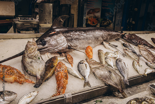 Bild auf Leinwand Assortment of fresh raw fish and swordfish displayed on ice at a seafood market