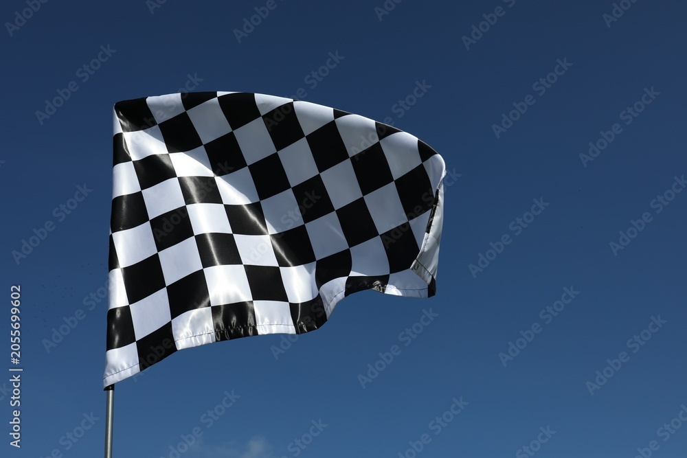 Obraz premium Checkered flag against blue sky outdoors, space for text