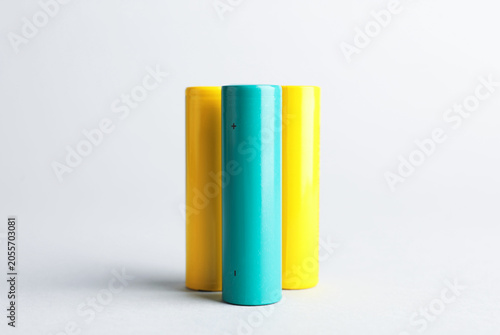 Tableau sur toile Many alkaline batteries on light background, closeup