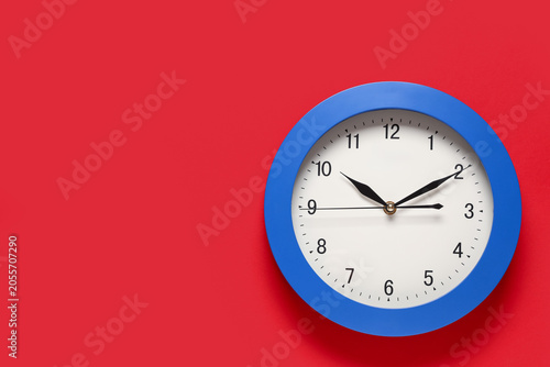 Blue round wall clock on re...
