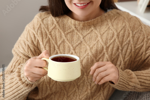 Cozy woman in knitted sweat...