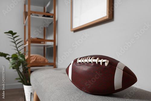 American football ball on g...