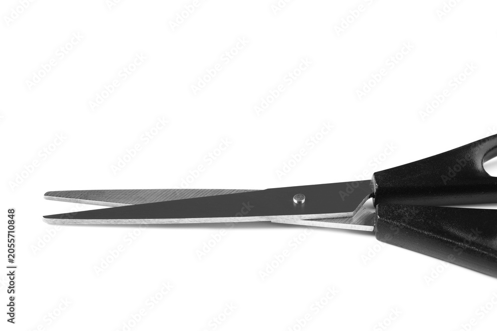 Fototapeta premium Sharp metal blades of black handled scissors for cutting and crafting, isolated on a clean white background