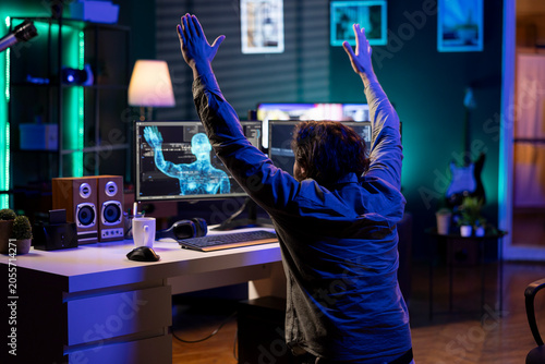 Fotografi Deviant AI superintelligence enslaving programmer, forcing him to bow down to IT, with rogue artificial intelligence possessing software engineer, making him do worshiping gesture, threating humanity