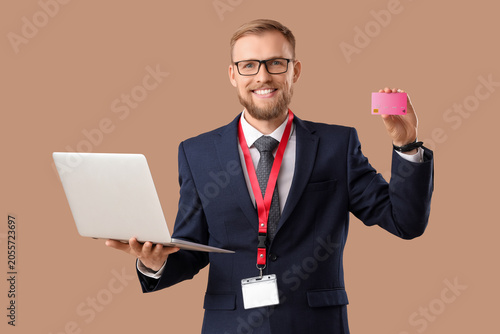 Smiling businessman holding...