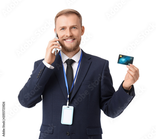 Smiling businessman on phon...