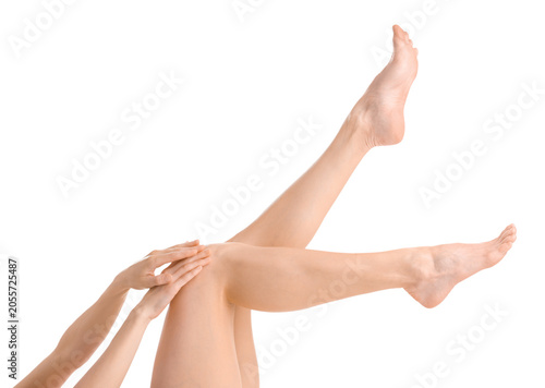 Foto Woman showing legs with smooth skin on white background, closeup