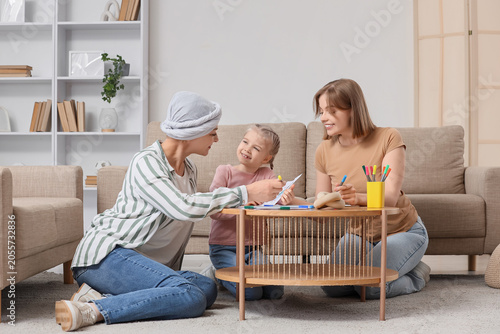 Cute little girl with her m...