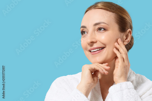 Smiling mature woman in whi...