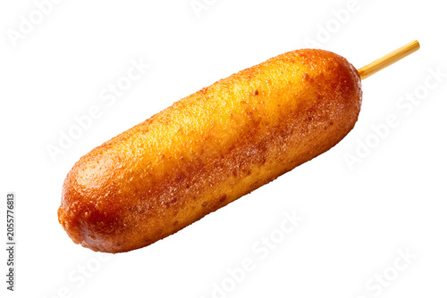 Golden brown corn dog on a wooden stick with crispy fried batter, isolated on white background.