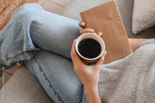 Relaxing woman holding coff...