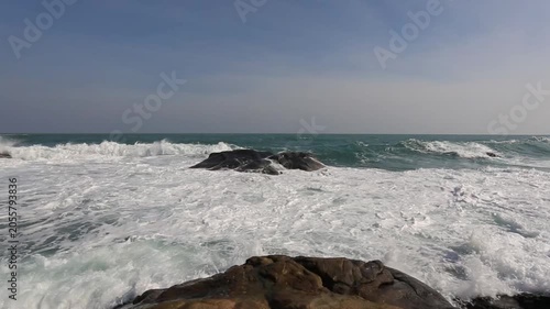 Huge waves crashing against the rocks。Stone Park Scenic Area, Hainan, China