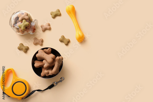 Tasty dog cookies on beige ...