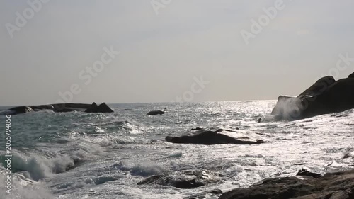 Huge waves crashing against the rocks。Stone Park Scenic Area, Hainan, China