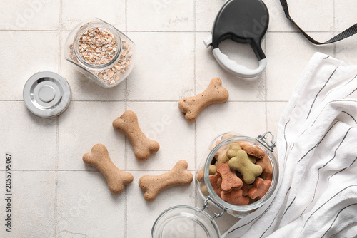 Jar with tasty dog cookies ...